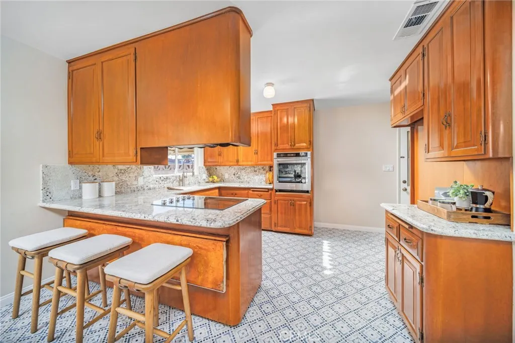 Kitchen with barstool seating and folding lower bar