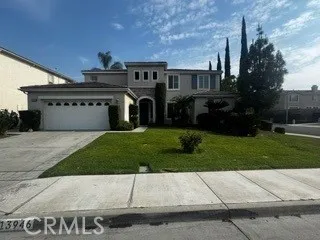 Beautiful two-story home featuring an inviting front entry, attached two-car garage, and well-maintained landscaping.