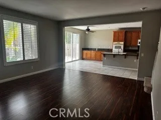 Additional view of the open living space and adjoining kitchen.