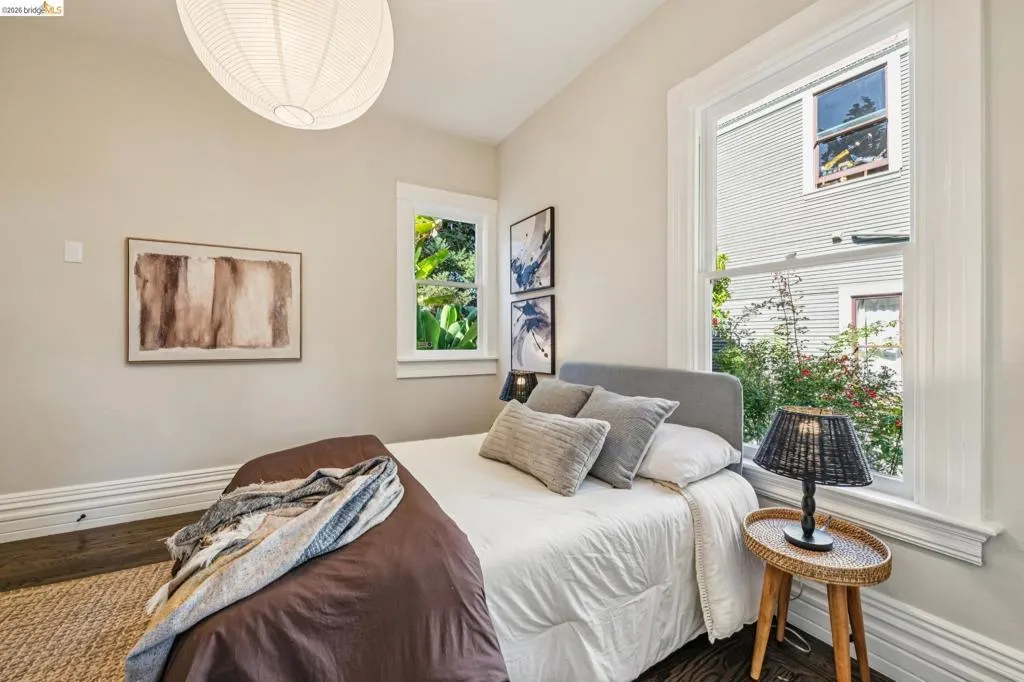 Recessed lighting, wood-finish flooring, and white trim
