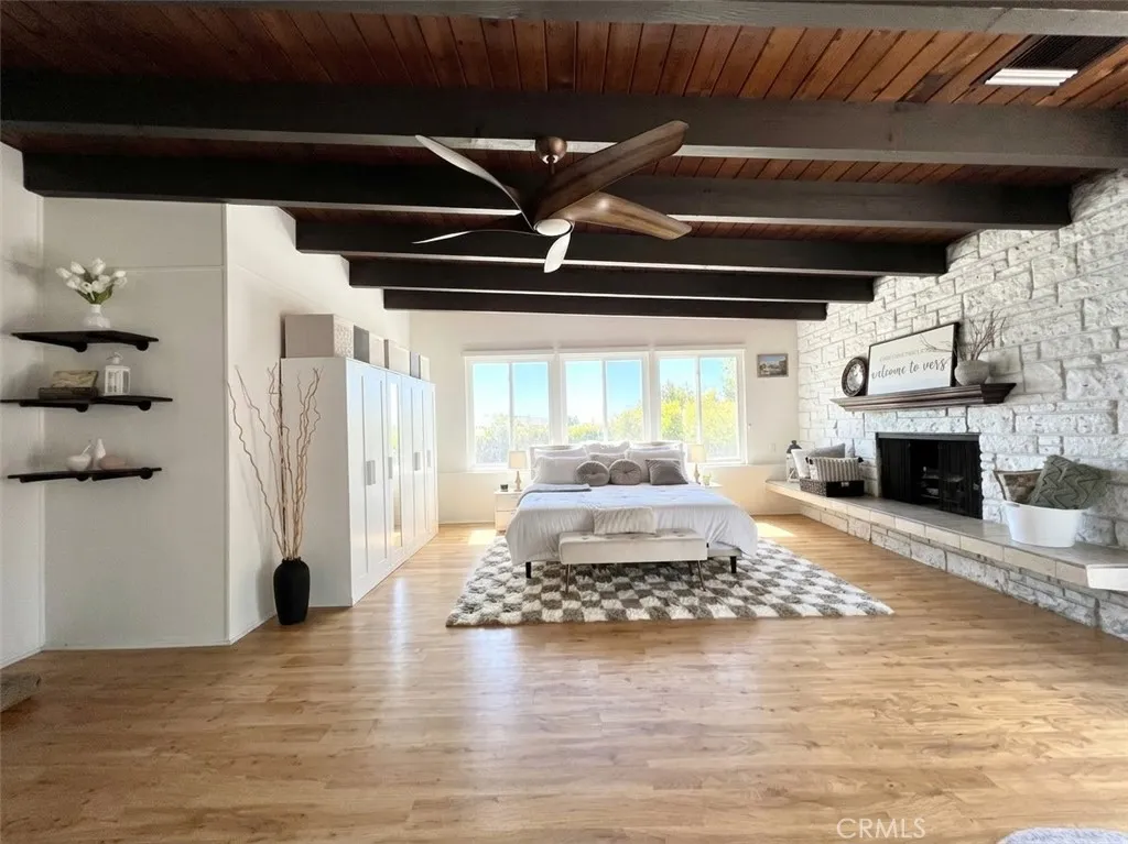 Primary Bedroom with Decorative Fireplace