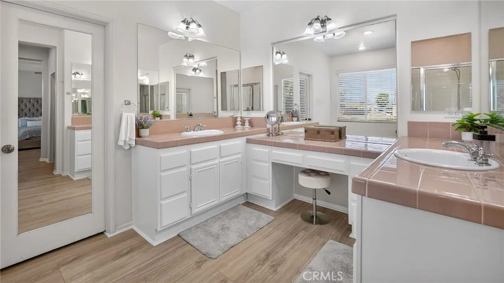Large walk in closet next to vanity area