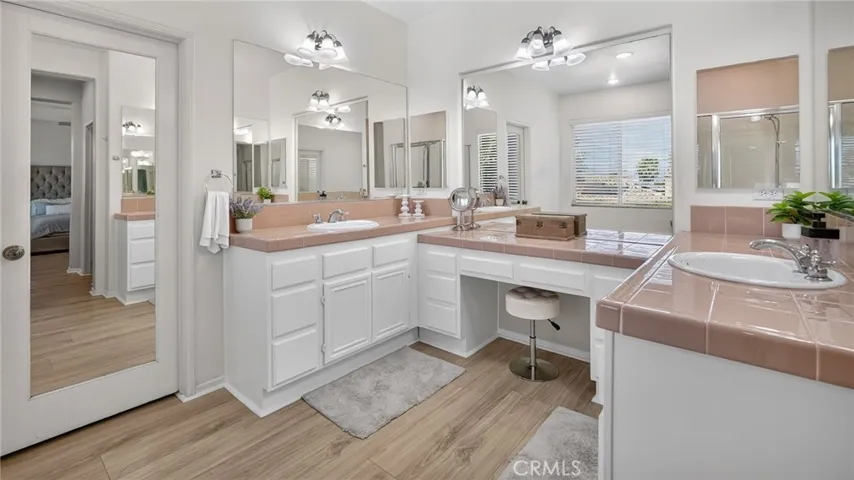 Large walk in closet next to vanity area