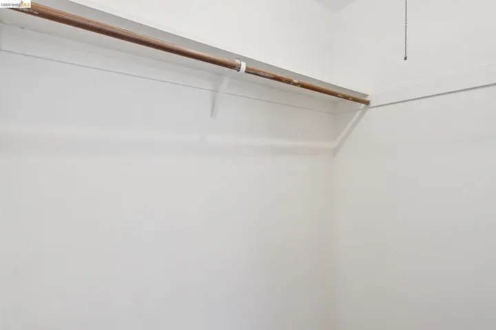 Bedroom – Walk-In Closet with Mirrored Doors
