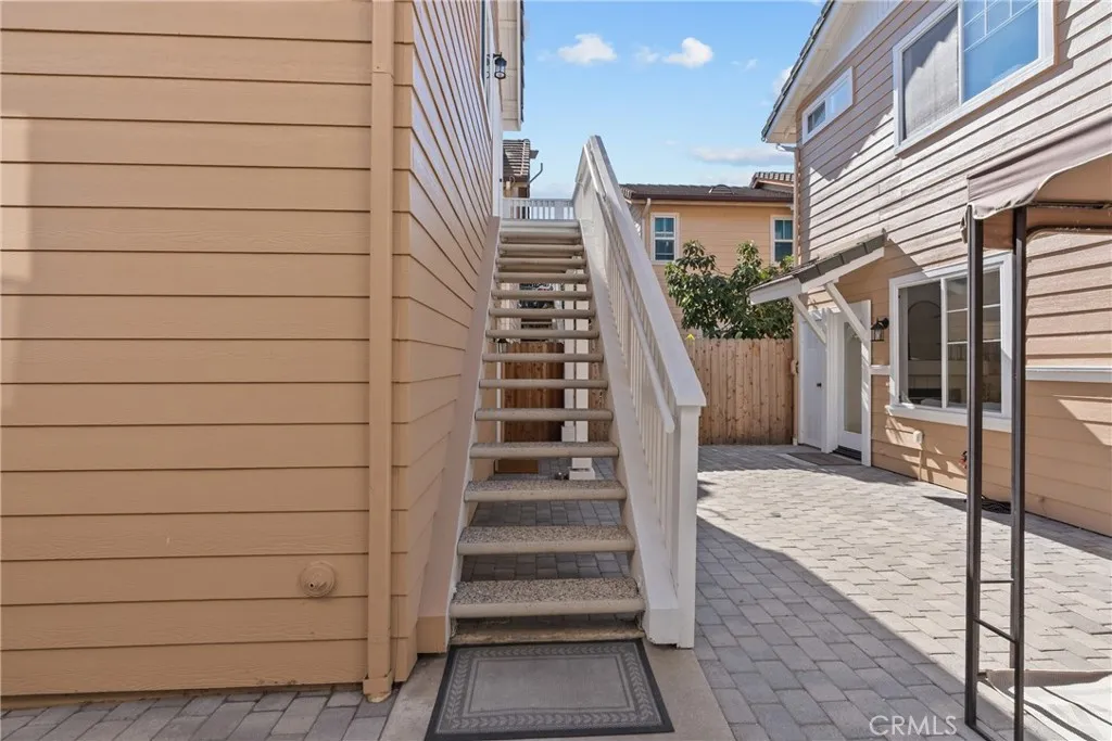 Staircase to 4th bedroom and full bathroom.