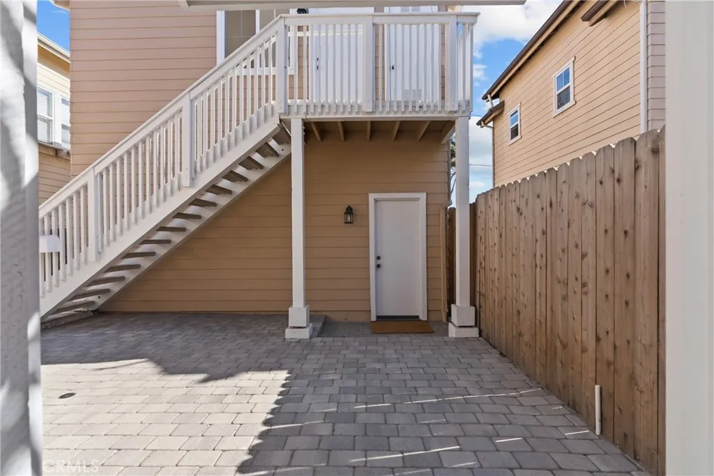 Staircase to additional bedroom and full bathroom.