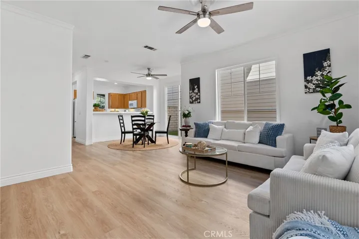 Living room open to dining room and kitchen.
