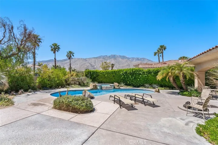 Beautiful pool and spa with water fall and views of the mountains