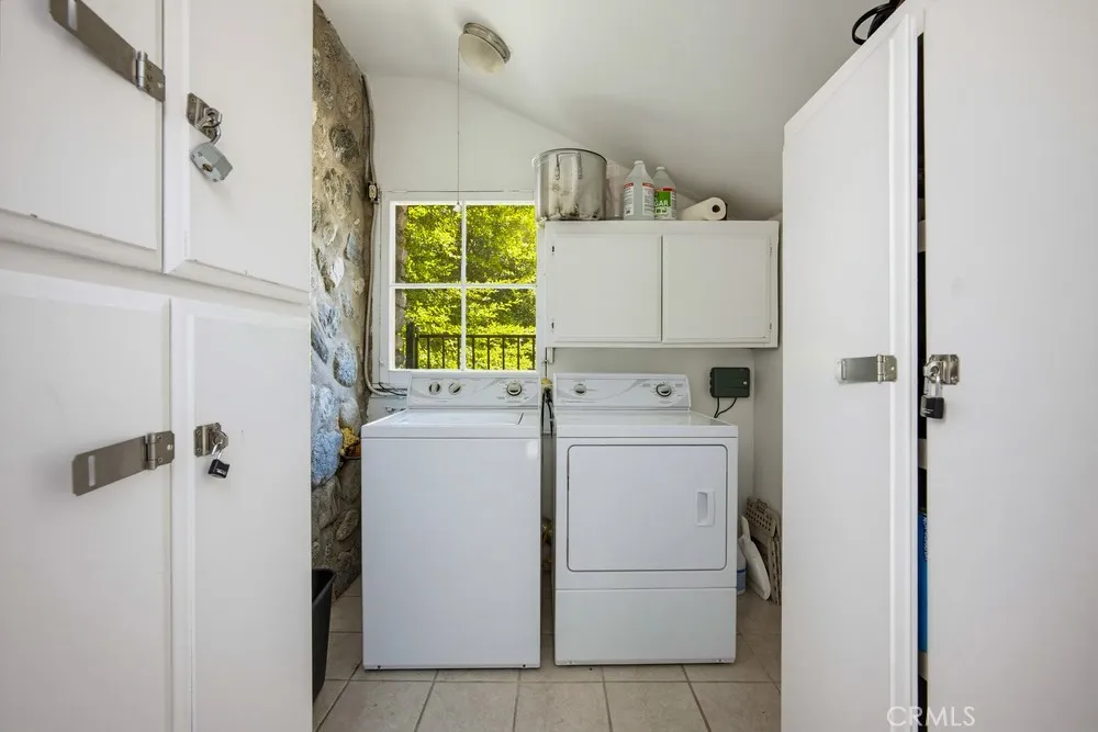 Washer and Dryer Room in separate room attached to garage