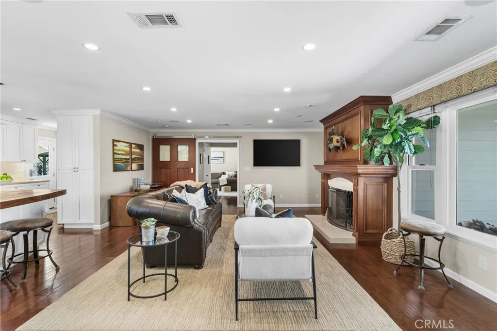 A custom barn door leads to a private 4th bedroom with large closet (currently used as a den/family room)