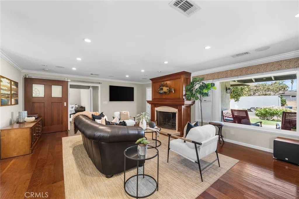 A large picture window and fireplace anchor the living room
