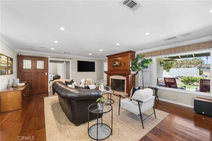 A large picture window and fireplace anchor the living room