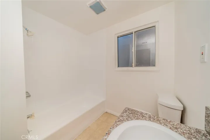 Full bathroom with tub.