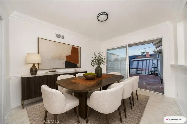 Virtually staged dining room next to patio.