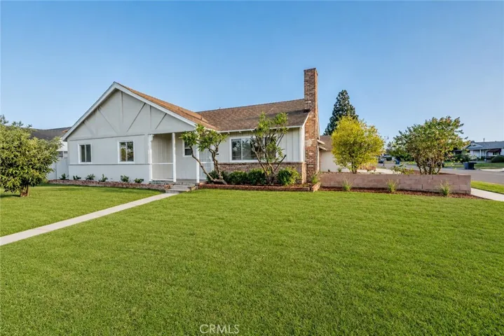 Front yard features water sprinkler system.