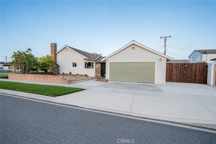 Side entry. Additional gated parking next to garage.