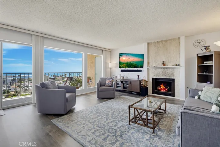Living room featuring fireplace and views