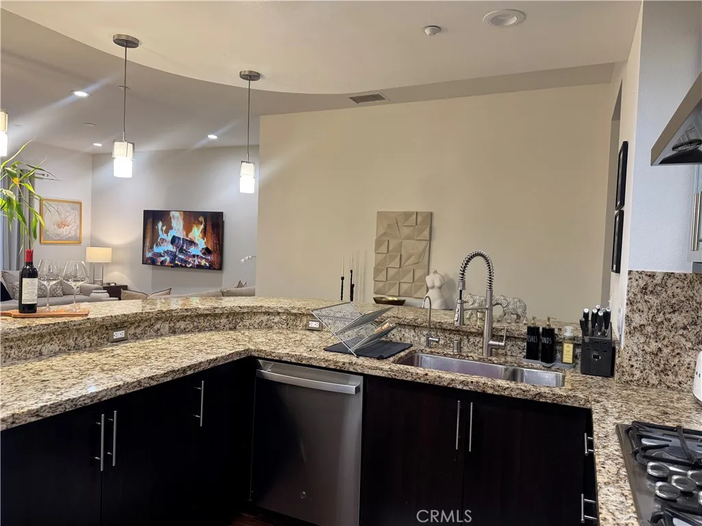 kitchen opens to the living and dinning area.