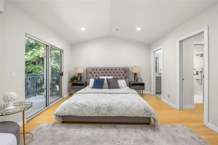 Primary Bedroom with Balcony Entry, Walk-in Closet and Primary Bathroom