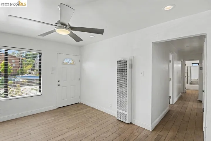 Wood-finish flooring, recessed lighting, and a modern ceiling fan with integrated lighting