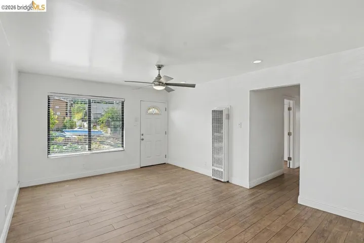 Wood-finish flooring, recessed lighting, and a modern ceiling fan