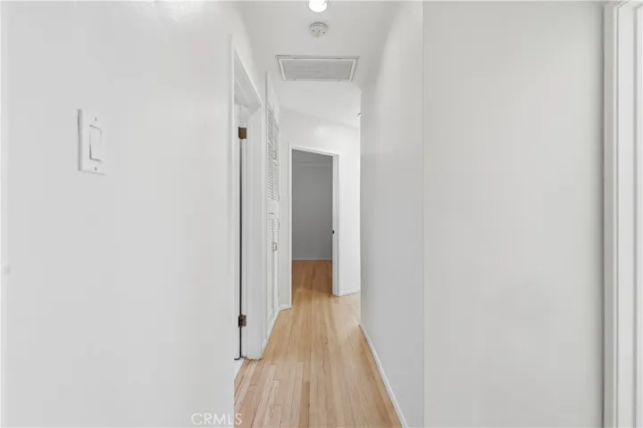 Hallway leading to the bedrooms and bathroom