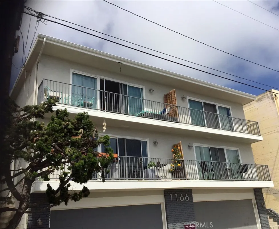 Front of Property with 4 units and garages below
