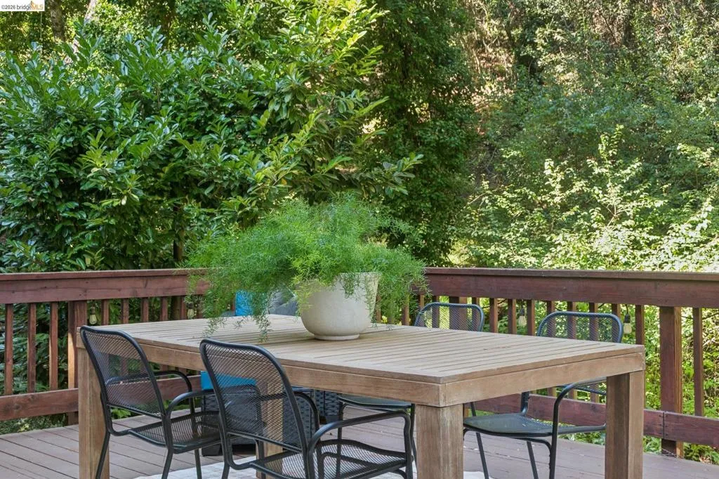 Wood-finish deck with a full-height railing