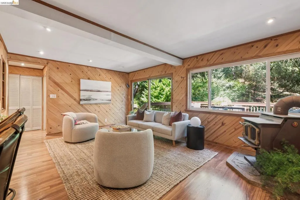 Wood-finish flooring throughout, complemented by wood-paneled walls