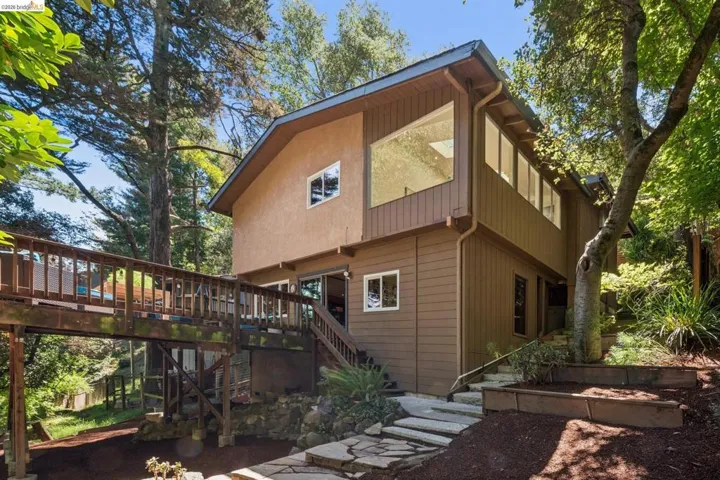 Multi-level exterior with board and batten siding and stucco accents