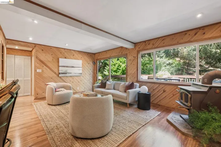 Wood-finish flooring throughout, complemented by wood-paneled walls