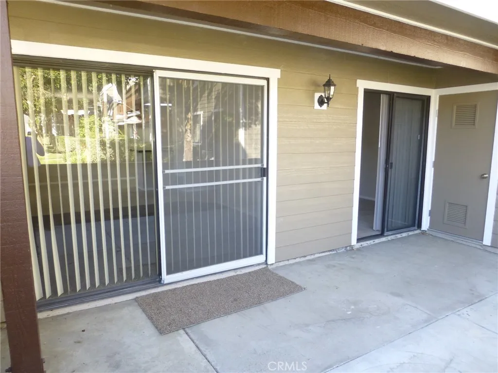 Patio access to living room and 3rd bedroom/den