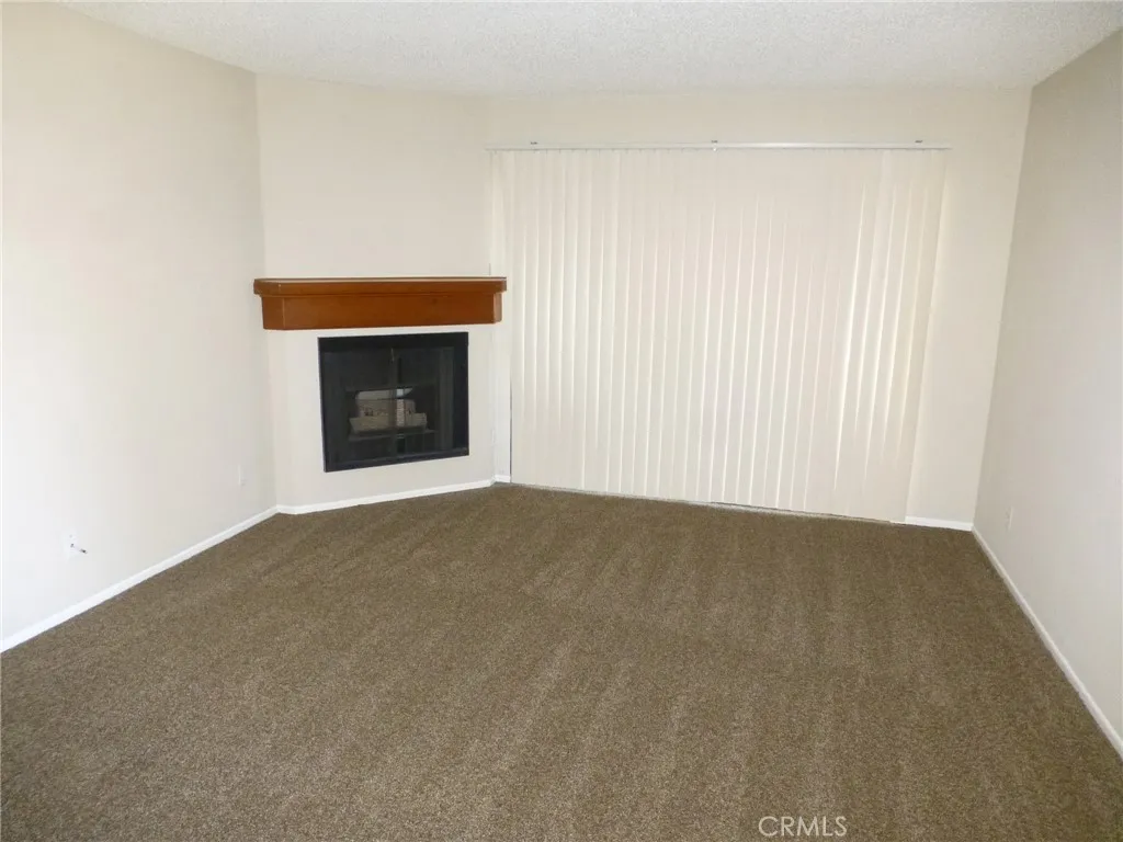 Living room, fireplace and sliding patio door access