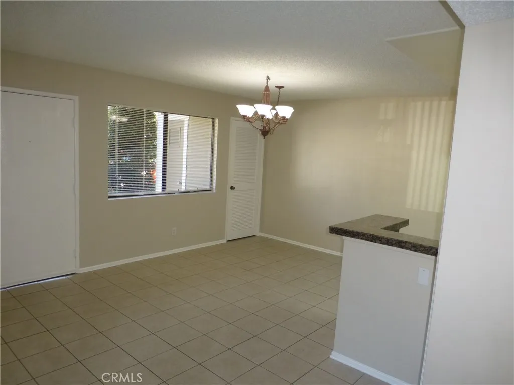 Family kitchen eating area with pantry closet