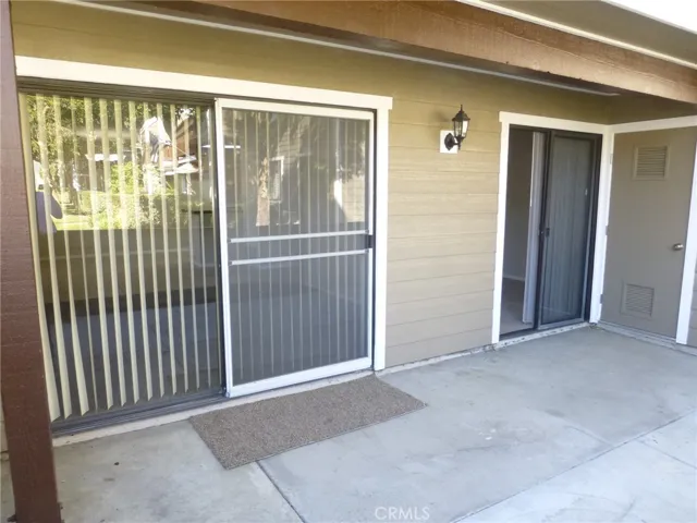 Patio access to living room and 3rd bedroom/den