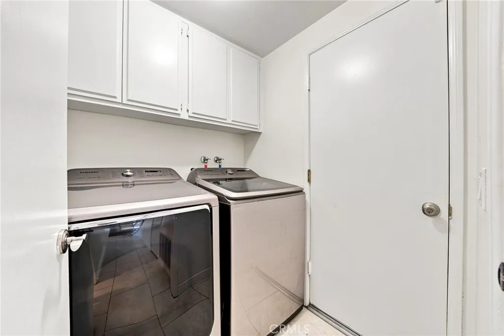 The main level includes an interior laundry room with built-in cabinetry for additional convenience. The main level includes an interior laundry room with built-in cabinetry for additional convenience.