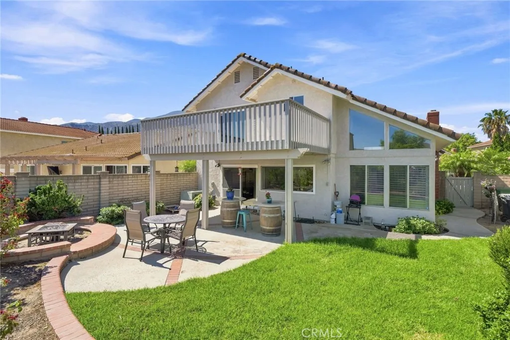 The backyard takes full advantage of the scenic setting with a covered patio, lawn area, fruit trees, fire pit, and plenty of space for outdoor dining, entertaining, The backyard takes full advantage of the scenic setting with a covered patio, lawn area, fruit trees, fire pit, and plenty of space for outdoor dining, entertaining,