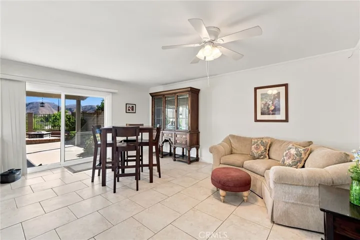 The separate family room offers plenty of space to relax and features sliding glass doors that open to the backyard and beautiful mountain views.