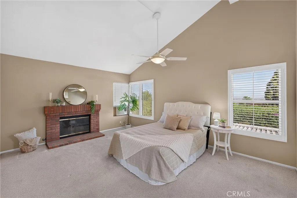 Primary Bedroom is spacious and peaceful. Vaulted Ceilings, Fireplace, Beautiful Views and Double Door Entry.