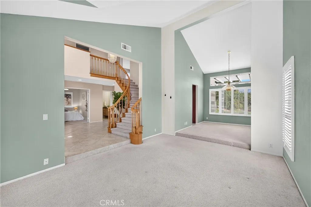 Living Room to Dining Room. High Ceilings create a greater space.