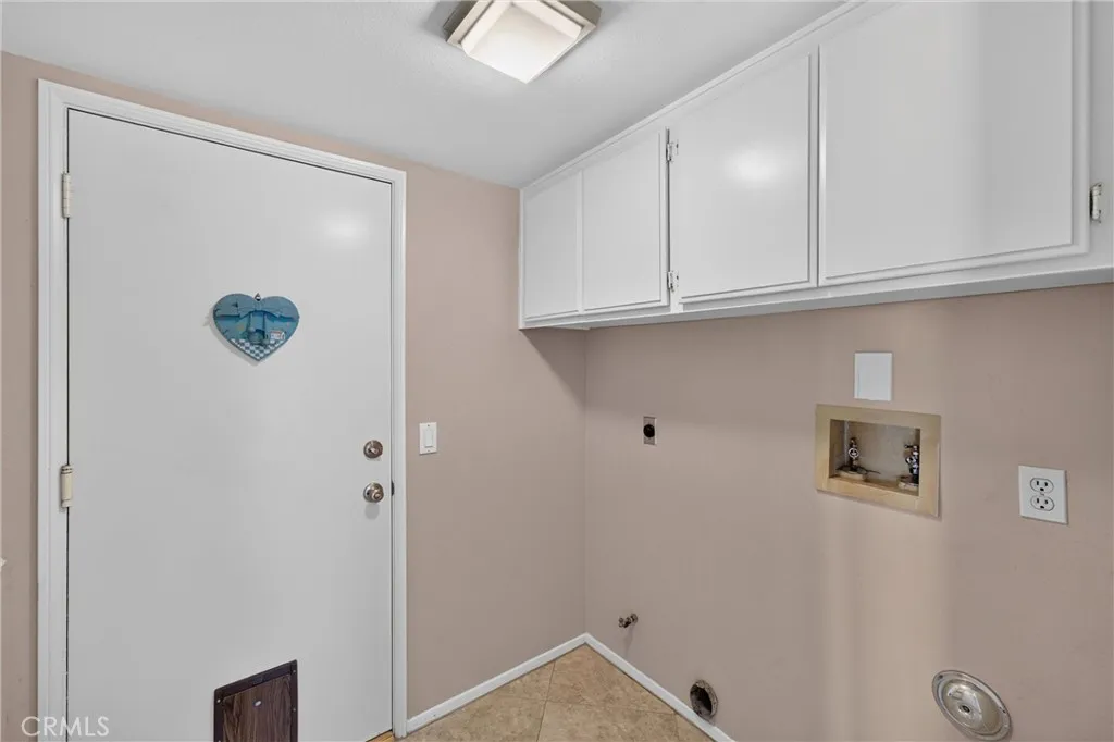 Laundry Room, Upper Cabinets, leads to garage