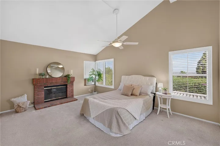 Primary Bedroom is spacious and peaceful. Vaulted Ceilings, Fireplace, Beautiful Views and Double Door Entry.