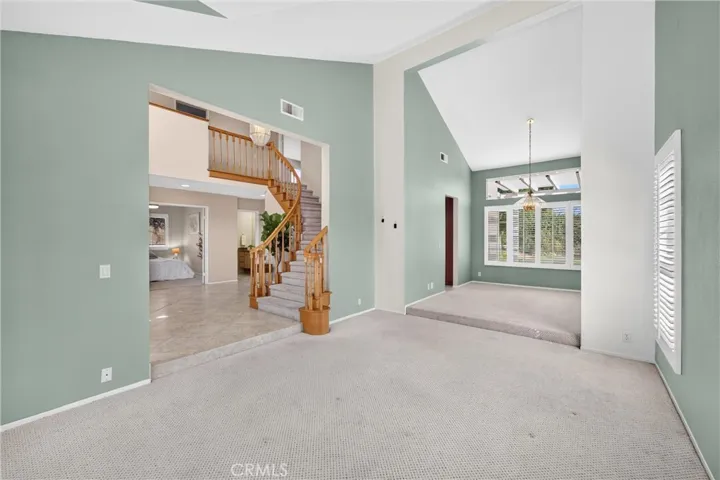 Living Room to Dining Room. High Ceilings create a greater space.