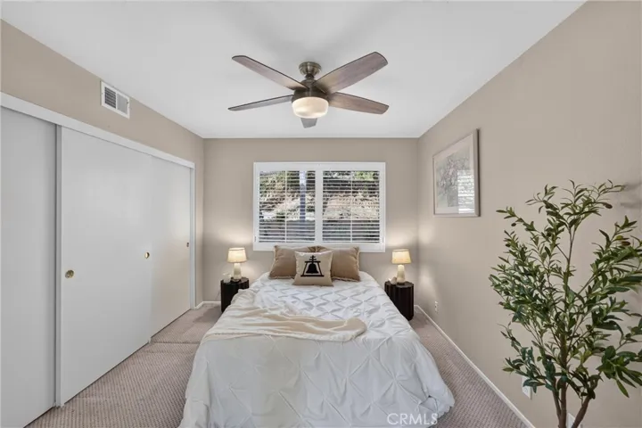 Downstairs Bedroom: 1 of 4 Plantation Shutters, Ceiling Fan, Large Closet, Double Door Entry