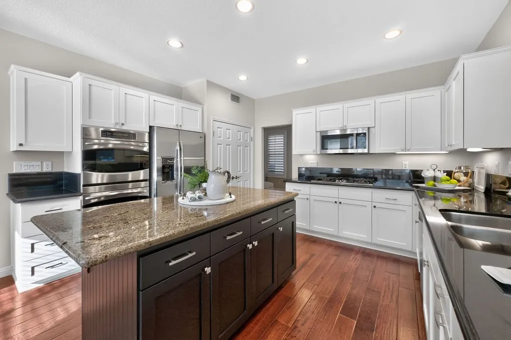 Ample cabinetry and double door pantry adjacent to dining toom