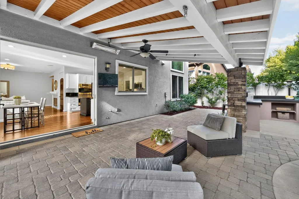 Gorgeous wood beamed covered living area