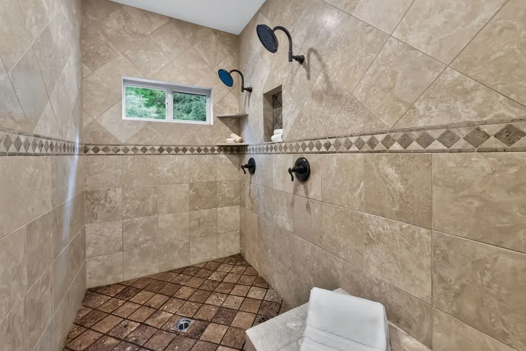 A shower for two with tree views and built in seating
