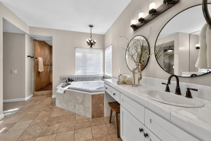 Fresh cabinets, new lighting and beautiful travertine floors