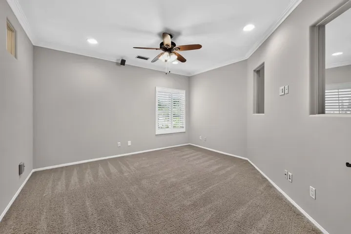 Large bedroom with double glass doors at the top of the stairs