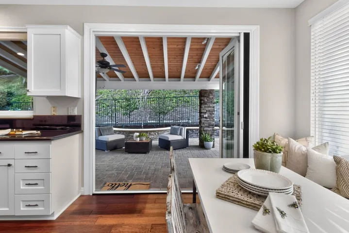 Glass doors invite to the outside living area